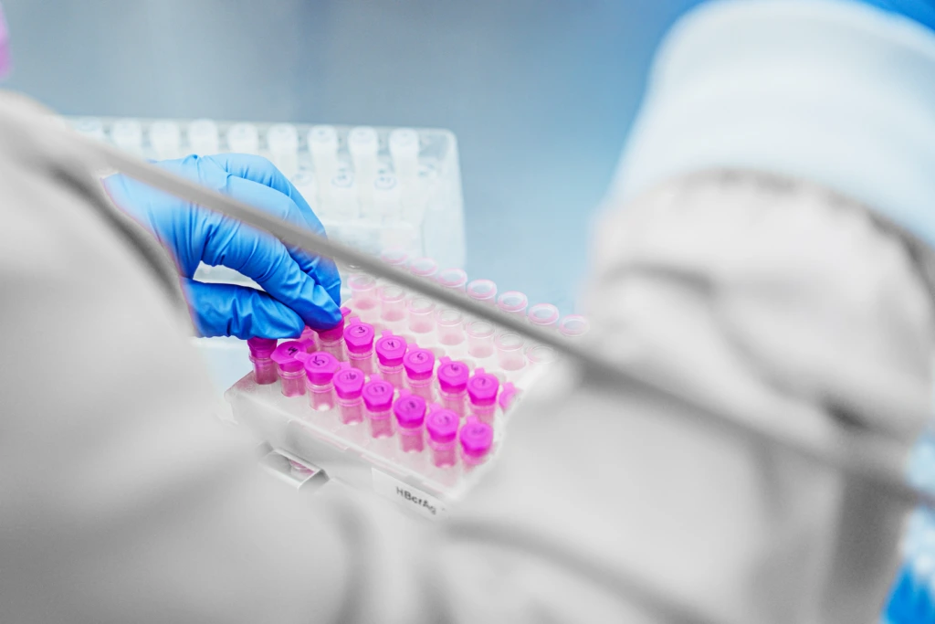Close up of scientist working with samples in a safety cabinet A