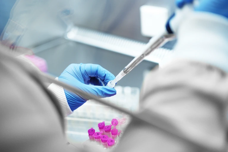 Close up of scientist working with samples in a safety cabinet B