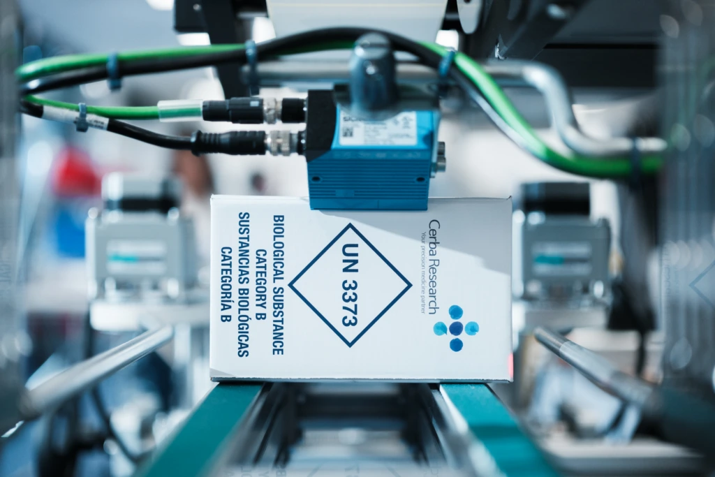 Extreme close up of Cerba Research sample on packing conveyor system