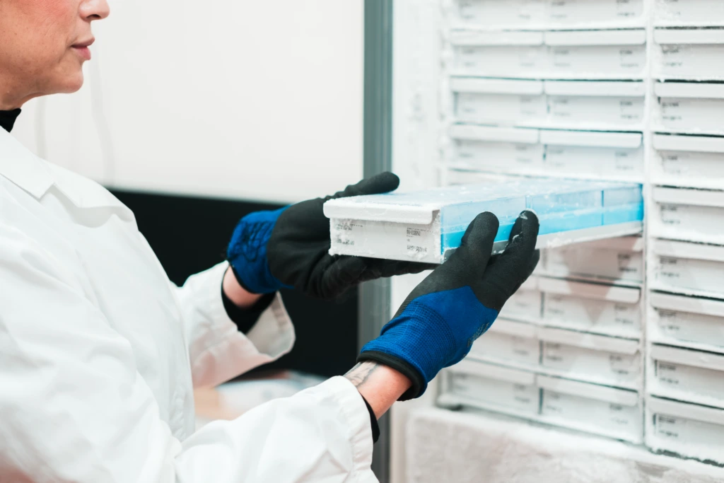 Female scientist accessing cold storage system B