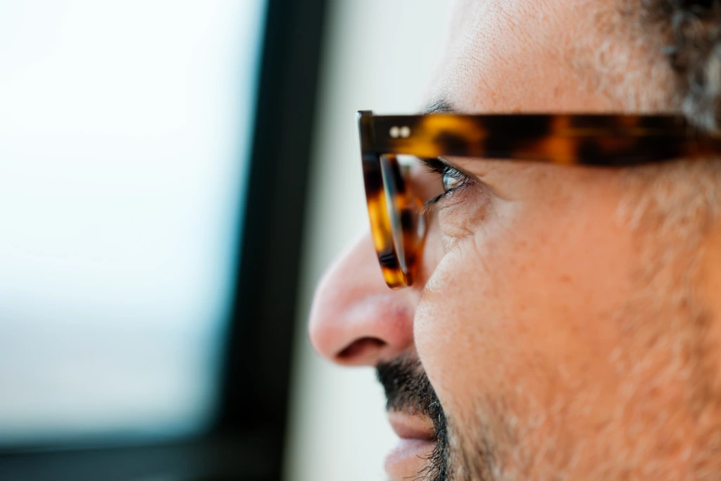 Extreme close up side profile portrait of male scientist
