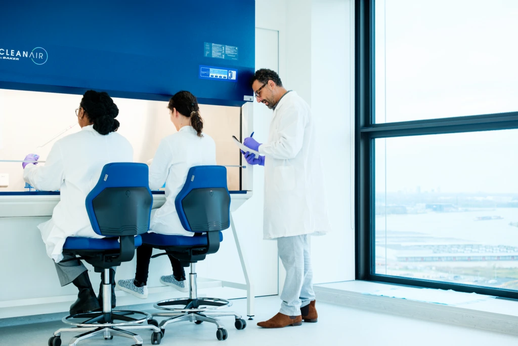 Scientists collaborating in modern laboratory workspace