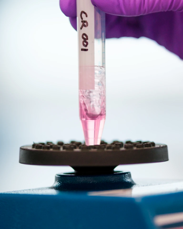 Close up of sample tube inserted into laboratory mixer