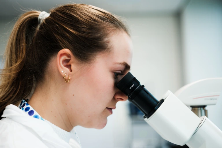 Portrait of scientist using laboratory microscope