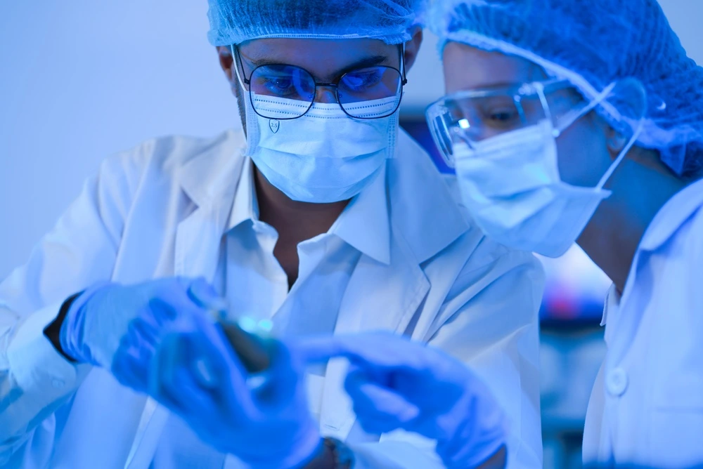 A,Diverse,Science,Team,Inspect,A,Sample,With,Focused,Care